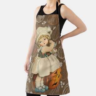 Mädchen schnitzt Apfel Halloween Schürze