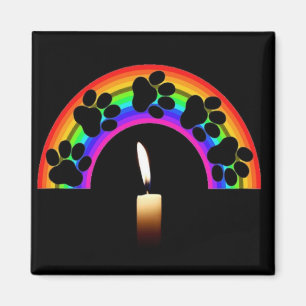 Magnet auf einem Regenbogen mit Kerze