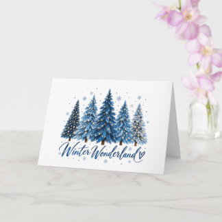 Magnifique carte de Noël aux pins bleus en hiver 