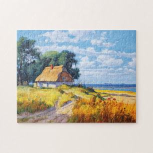 Maleriischer Sandweg, der zu einer Reetgedeckten C