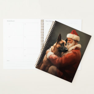 Malinois belge avec le Père Noël festif de Noël