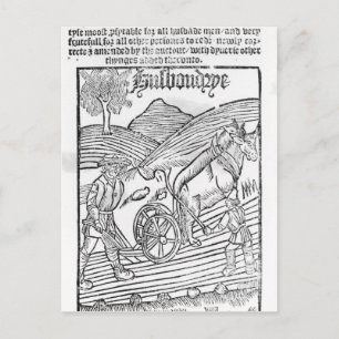 Man pflügt ein Feld Postkarte