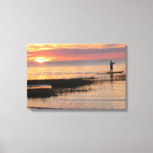 Mann auf Wasserboard bei Sonnenuntergang auf Cape  Leinwanddruck