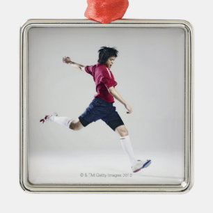 Männlicher Fußballspieler, der sich vorbereitet, Silbernes Ornament
