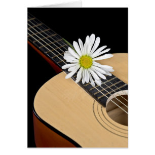 Marguerite blanche sur guitare