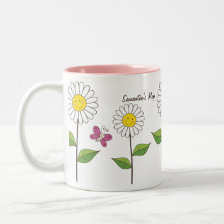 Marguerites de sourire et tasse faite sur commande