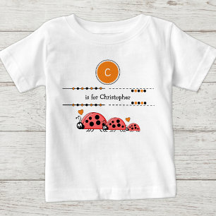 Marienkäfer fügen Namen schwarz und orange hinzu Baby T-shirt