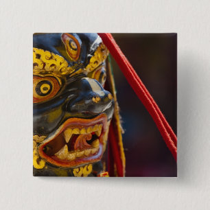 Maskentanzdarbietung beim Tshechu-Festival Button