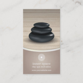 Massage-Steine auf hölzerner Terminkarte
