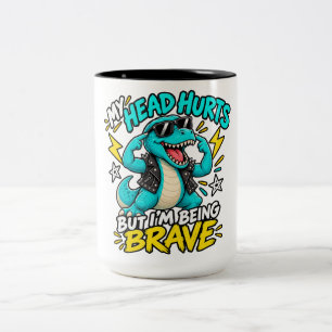 MEIN KOPF SCHMERZT, ABER ICH BIN TAPFER ZWEIFARBIGE TASSE