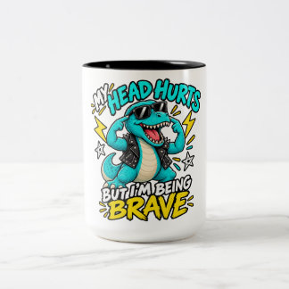 MEIN KOPF SCHMERZT, ABER ICH BIN TAPFER ZWEIFARBIGE TASSE