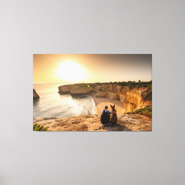 Mensch und Hund mit Blick auf die Natur Leinwanddruck (Vorderseite)