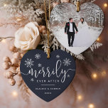 Merrily Ever After | First Married Christmas Photo Keramik Ornament<br><div class="desc">Personalize this festive holiday ornament with your names and the year for a chic way to commemorate your first married Christmas! Perfect for newlyweds, this heart shaped design features "merrily ever after" in a mix of white calligraphy script and block typefaces, accented with white snowflakes. Add your favorite wedding photo...</div>