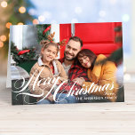 Merry Christmas Elegant Calligraphy Script Photo Feiertagskarte<br><div class="desc">Folded Christmas photo card features an elegant white "Merry Christmas" calligraphy script overlay design with custom text that can be personalized with your name(s), the year, and a favorite landscape style photo. The inside of the card includes additional text that can be personalized with a custom message. Photo credit: Sunbeam...</div>