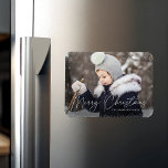 Merry Christmas Snow Flurries Photo Magnet<br><div class="desc">Wish friends and family a Merry Christmas with a cute holiday photo magnet! The magnet features your horizontal photo with subtle snow flurries bordering the design. "Merry Christmas" is displayed in a white,  trendy calligraphy script with your family's name below.</div>