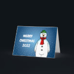 Merry und Happy Snowman Feiertagskarte<br><div class="desc">Der frohe Schneemann mit einem grünen Hut und einem roten Schal ist zu Weihnachten bereit.</div>