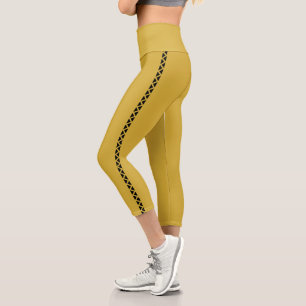 Metallisch goldene Capri-Leggings mit schwarzem Se Capri Leggings