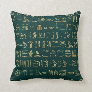 Metallische ägyptische Hieroglyphen auf Waldgrün Kissen