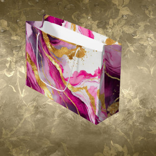 Metallische Geschenktüte mit Wirbeln in Rosa, Gold