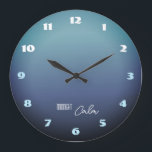 Midnight Calm Gradient Große Wanduhr<br><div class="desc">A stylish wall clock inspired by the quiet beauty of midnight. The soft gray-blue gradient background evokes a calm night sky illuminated by moonlight. Bold modern numbers in white and turquoise create a striking contrast while keeping the design balanced and elegant. The “Midnight Calm” message adds a peaceful, relaxing mood—perfect...</div>