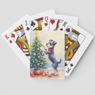 Miniaturschnauzer beim Schmücken des Weihnachtsbau Spielkarten