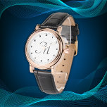 Minimal einfache Anfangsbuchstaben schwarz | Armbanduhr<br><div class="desc">Erleben Sie zeitlose Eleganz mit dieser atemberaubenden Armbanduhr, die mit einem klassischen Goldgehäuse aus der Rose und einem Vintag inspirierten schwarzen Gurt kombiniert wird. Das raffinierte Design umfasst ein elegantes schwarzes Zifferblatt mit minimalistischen Ziffern und ein delikates Monogramm, das einen eleganten Kontrast zu den goldenen Farbtönen der warmen Rose schafft....</div>