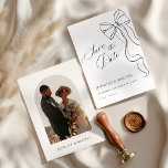 Minimalist Black Bow Save The Date Einladung<br><div class="desc">Announce your special day with timeless elegance. This Save the Date card features a graceful black bow line illustration on the front and your favorite photo framed in a soft arched window on the back. The clean white background and refined typography make it the perfect choice for modern and romantic...</div>