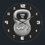 Minimalist Fitness Motivation Große Wanduhr<br><div class="desc">This bold Time to Lift wall clock features a powerful kettlebell design on a sleek black background, creating a strong and modern gym aesthetic. The minimalist style makes it a perfect addition to any home gym, workout room, or fitness studio. The large kettlebell centerpiece with the motivational phrase “Time to...</div>