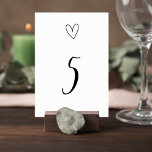 Minimalist Wedding Table Number Card with Heart Tischnummer<br><div class="desc">Description Complete your reception table décor with this elegant minimalist wedding table number card featuring a clean black-and-white design with a delicate heart illustration above a stylish script table number. The simple yet romantic layout creates a timeless look that blends beautifully with modern, classic, or minimalist wedding themes. The bold...</div>