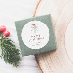 Minimalistisch MistletoCustom Christmas Family Nam Runder Aufkleber<br><div class="desc">Ein individueller Weihnachtsaufkleber mit einer schönen handbemalten Mistelanordnung, die an der Oberseite des Aufklebers hängt. Im Folgenden werden "fröhliche Weihnachten" oder eine Nachricht Ihrer Wahl in Kleinbuchstaben serf Typografie gedruckt. Am unteren Rand des Aufklebers ist Ihr Familienname in Serif-Hauptstädte geschrieben. Ideal zum Abdichten von Umschlägen, Dekorieren von Geschenkboxen oder zum...</div>