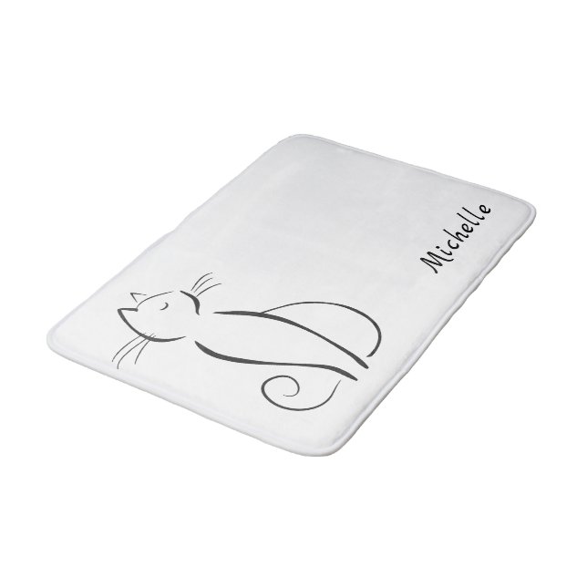 Minimalistische schwarze Katze mit weißem Namen Badematte (Schrägansicht)