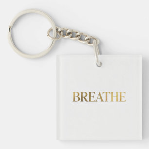 Minimalistische Typografie mit dem goldenen Wort a Schlüsselanhänger