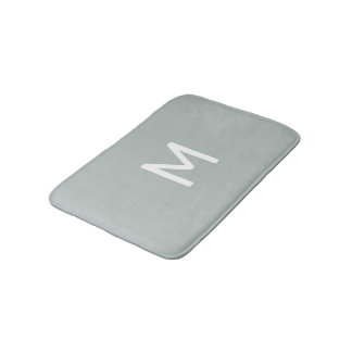 Minimalistisches weißes Monogramm auf Grau Badematte