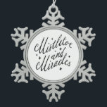 Mistletoe and Miracles Black and White Schneeflocken Zinn-Ornament<br><div class="desc">This festive ornament brings classic holiday charm with a bold, modern twist. The design features a white background that instantly captures the eye, while the phrase “Mistletoe and Miracles” is elegantly written in black script at the center. Surrounding the text are delicate, star-like sparkles that add a touch of seasonal...</div>