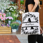 Modern Black Floral Wreath Split Monogram "A" Tasche<br><div class="desc">This refined floral split monogram wreath design features a delicate botanical arrangement forming a graceful circular frame around a customizable monogram "A". The balanced composition highlights elegant leaves and floral accents that create a timeless and sophisticated look. Perfect for personalized gifts, wedding décor, home accessories, and custom stationery, this design...</div>