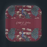 Modern Burgundy Floral Peacock Wedding Pappteller<br><div class="desc">These elegant Modern Burgundy Floral Peacock Wedding Paper Plates feature hand-drawn blue and teal peacocks perched on blooming magnolia branches in delicate black ink against a dramatic burgundy background. Personalize with initials, names, and a wedding date for a refined custom touch. Perfect for wedding receptions, bridal showers, engagement parties, and...</div>