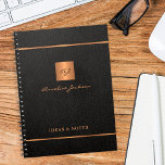 Modern elegant black gold monogrammed name notizblock<br><div class="desc">Luxury exclusive looking monogrammed stylish personalized notebook featuring a faux gold copper metallic glitter square and lines over a stylish classy black leather look background. Personalize it with your text, your name and monogram initials.</div>