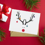 Modern funny abstract Christmas reindeer on white Feiertagspostkarte<br><div class="desc">A funny and cute modern abstract image of a reindeer head with a red nose. With Christmas Ornaments,  baubles Hanging from the Antlers. White background,  Colors: White,  Red,  Gray,  Blue,  Green</div>
