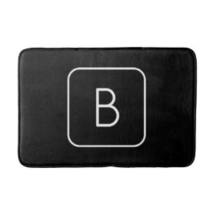 Modern gestyltes Anfangsmonogramm Weiß und Schwa Badematte