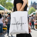 Modern Monogram Minimal Black White Tasche<br><div class="desc">Add a touch of modern elegance to your routine with this personalized monogram design featuring a large initial and name in script. Perfect for yourself or as a thoughtful custom gift. Created by Simply Farmhouse Press.</div>