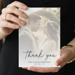 Modern Script Simple Minimal Wedding Dankeskarte<br><div class="desc">Show your appreciation with this elegant and personalized photo wedding thank you card. The front features a large, soft-focus space for your favorite wedding photo, overlaid with the stylish, black script of "thank you." Below, your names and wedding date are printed in a clean, modern font. On the reverse, you'll...</div>