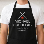 Modern Sushi Lab Name with Crossed Chopsticks Schürze<br><div class="desc">This design features a sleek culinary logo with crossed chopsticks, a bold red sushi-inspired icon, and clean white typography on a dramatic black background. The “Michael Sushi Lab” name is paired with the tagline “Mastering the Art of Rollcraft, ” giving it a refined, chef-driven identity. Its minimalist layout and high-contrast...</div>