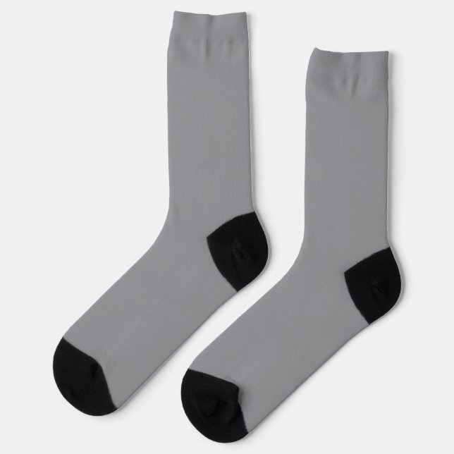 Moderne graue und schwarze gemusterte Socken (Linkes Detail)