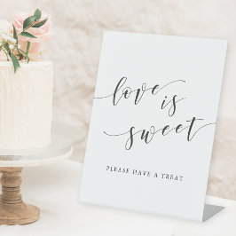 Moderne kalligraphische Liebe ist süßer Hochzeitst Sockelschild