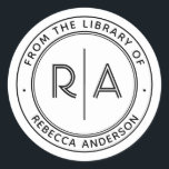 Moderne Minimal Monogram The Library of Buchzeiche Runder Aufkleber<br><div class="desc">Erweitern Sie Ihre persönliche Bibliothek mit unserem eleganten und minimalen "From the Library of" oder "This Book Belongs To" Buchzeichen. Dieses Buchzeichen mit seinen Monogramm-Initialen in einem modernen offenen Typ, der durch eine schmale vertikale Linie getrennt ist, enthält auch Ihren Namen und personalisierten Text in einem modernen serifenlosen Schriftart. Dieses...</div>
