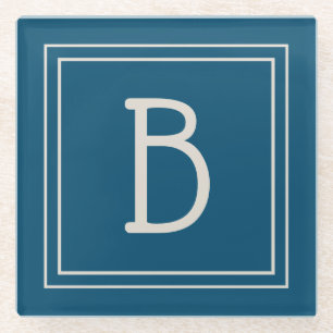 Moderne monogrammierte ozeanblaue und elfenbeinfar glasuntersetzer