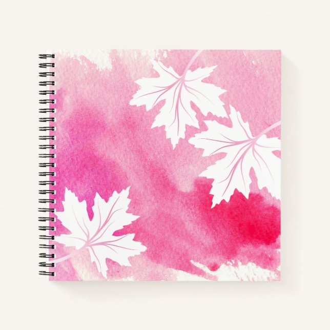 Moderne rosa Aquarellfarben und Blätter aus weißem Notizbuch (Vorderseite)