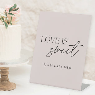 Moderne rosa Liebe ist süßer Hochzeitstisch Sockelschild