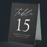 Moderne Schwarz-Weiß-Hochzeit-Tischnummer Tischaufsteller<br><div class="desc">Trendy, minimalistische Zeltschilder auf der Hochzeitszelt mit modernen, weißen Schriftzeichen mit "Tisch" in moderner Kalligraphie-Schrift. Das Design weist einen schwarzen Hintergrund oder eine Farbe Ihrer Wahl auf. Das Design wiederholt sich auf der Rückseite. Um die Tischnummer Zeltschilder zu bestellen: Personalisieren Sie Ihre Namen, das Hochzeitsdatum und die Tischnummer. Fügen Sie...</div>