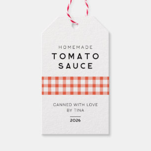 Moderne selbstgemachte Tomatensauce mit kariertem  Geschenkanhänger